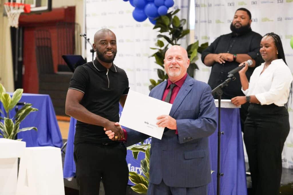 a graduate receiving his diploma or certification