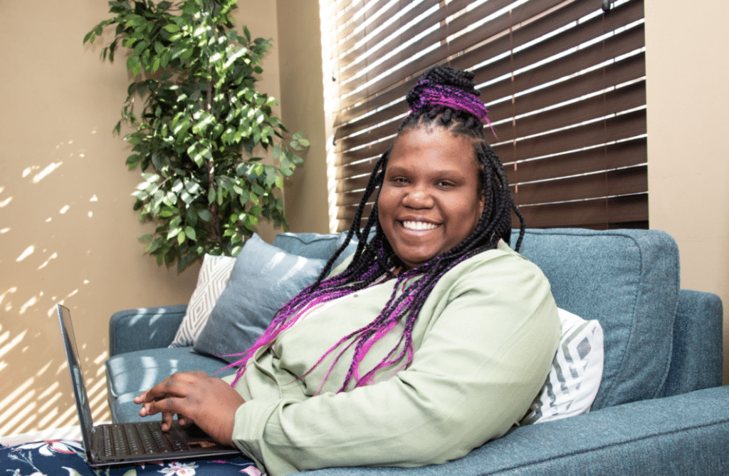 a girl sitting on a couch at the youth in transition